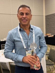Rocco Romeo, CEO of HLS Linen Services accepting ARTA Award